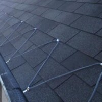 Roofing contractor working on a clay tile roof